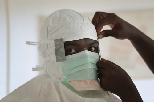 an MSF (Médecins Sans Frontières/Doctors Without Borders) nurse is prepared with Personal Protection