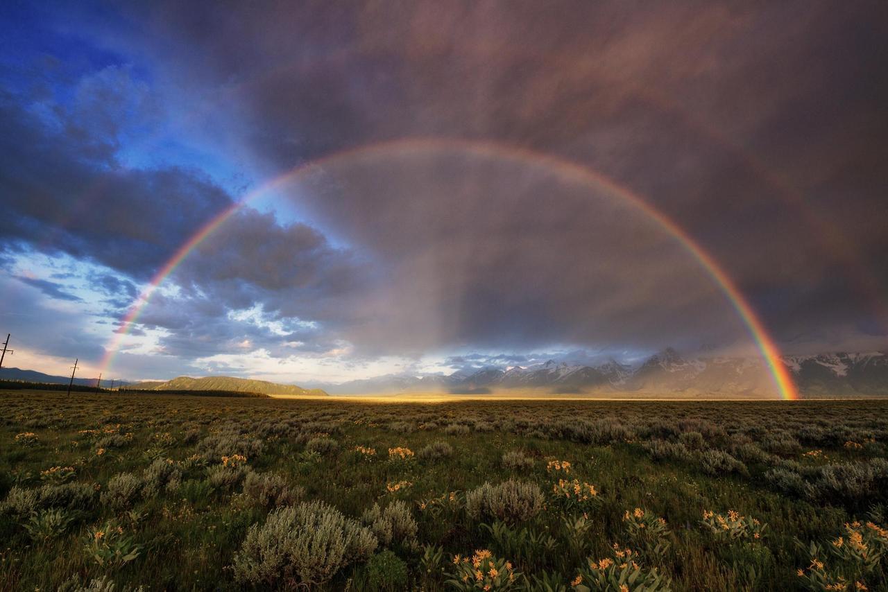 Sunrise lit up a double rainbow into a golden arch (Grand Teton National Park, Wyoming, USA)[OC][2000x1335] via /r/EarthPorn http://ift.tt/2xXxj0q