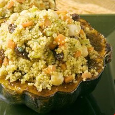 Vegetables, garbanzos, raisins and couscous in a lovely Moroccan broth taste delicious inside butter