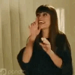 A gif of a woman pacing around and gesturing erratically.