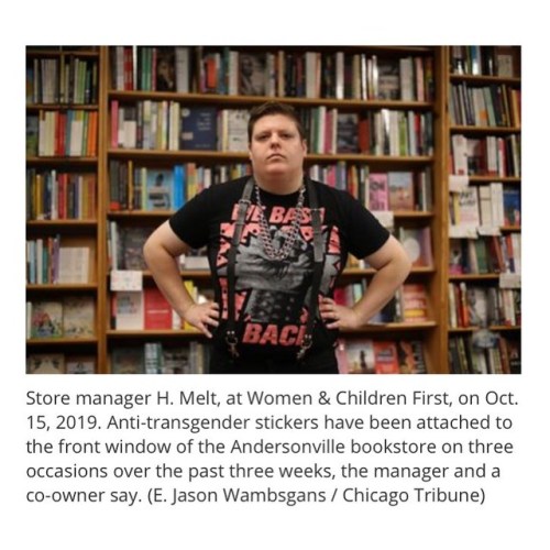 Trans books behind me. I refuse to be silent about transphobic harassment happening at my workplace,