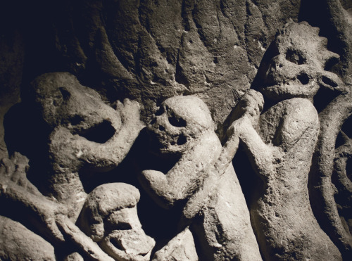 Depictions of hell and torture on the 12th C Doom Stone in York Minster- UK 