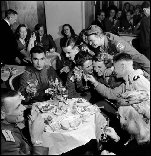 Russian and American soldiers, part of the Allied occupation forces, at a multinational party, Berli