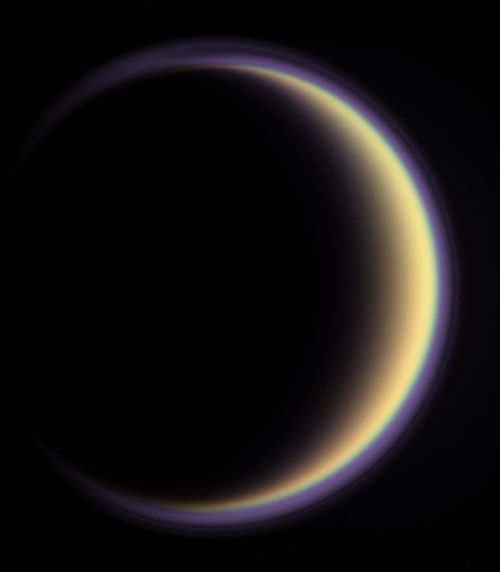 s-c-i-guy:Titan’s HaloWith its thick, distended atmosphere, Titan’s orange globe shines 