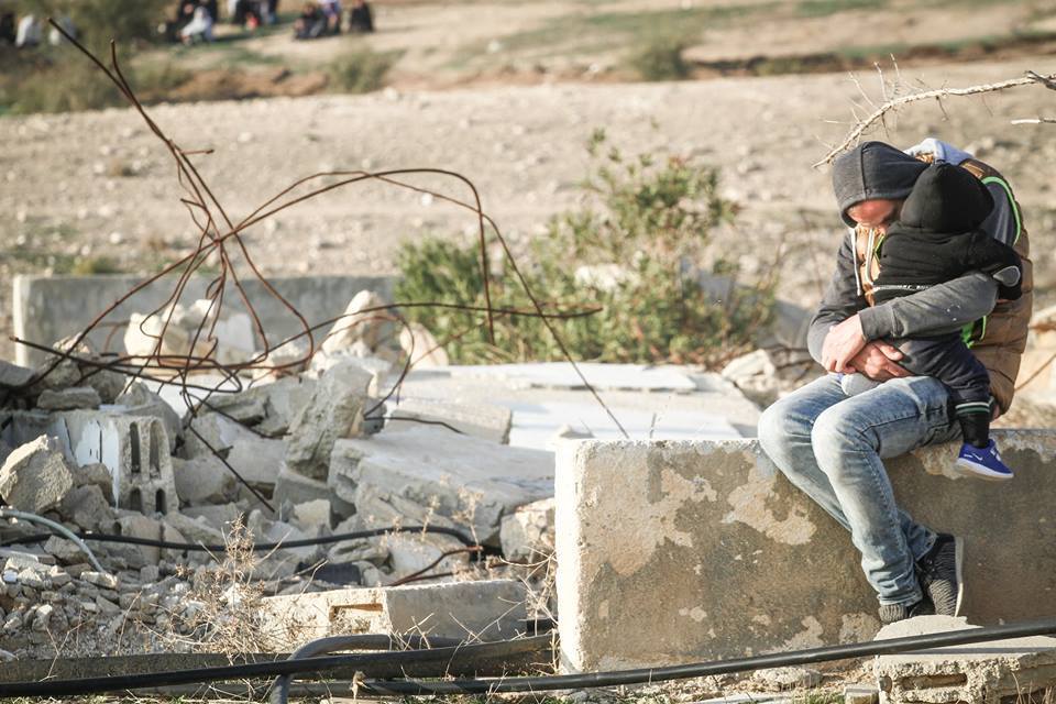 aishawarma:  A man and his baby after their house was demolished by Israeli forces