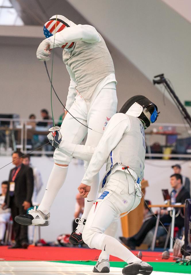 modernfencing:  [ID: a foil fencer leaping into the air as he twists to hit his opponent.]Race