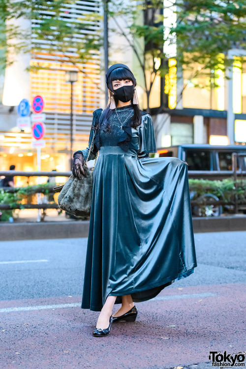 18-year-old Japanese student Mikael on the street in Harajuku wearing a green velvet dress by Pameo 