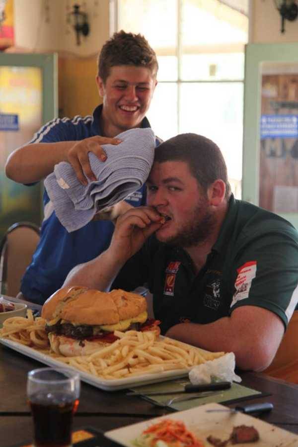 The boy has a healthy appetite (Road Train Burger and fries at the Nindigully Pub,