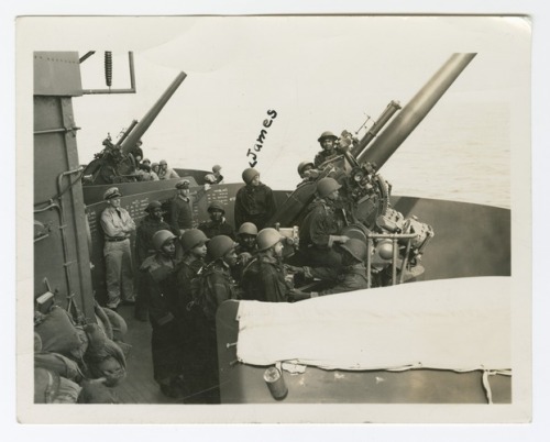 Photograph of James Lane firing a gun on the deck of the USS Indianapolis, July 1942, Smithsonian: N