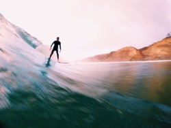 juliacrowleyphotography:  Stormy sunset swell at Blacks Beach Follow my insta for more @juliacrowley_ 