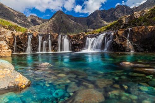 madeofpatterns:  odditiesoflife:  The Fairy Pools on the Isle of Skye The stunning rock formations caused by erosion from the crystal clear water running down from the Cullins, the largest mountains on the Isle of Skye in Scotland, created the legendary