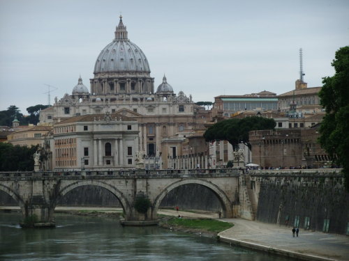 florenceandtheinsertpunhere:St. Peter’s Basilica on the Tiber river. The Vatican Radio Tower is also