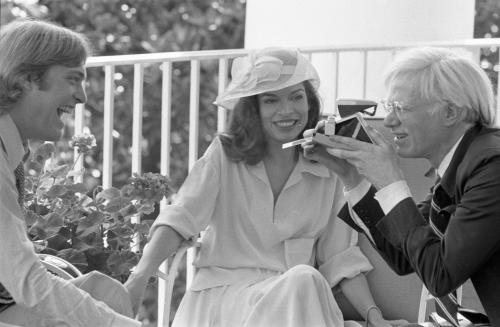 Andy Warhol takes a Polaroid of President Ford’s son, Jack, as Bianca Jagger looks on. The three met on the Truman Balcony off the White House residence on July 2, 1975.
-from the Ford Library