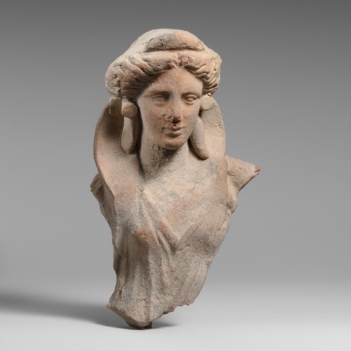 Greek, Terracotta fragment of the upper body of a woman, 4th century BC (source).