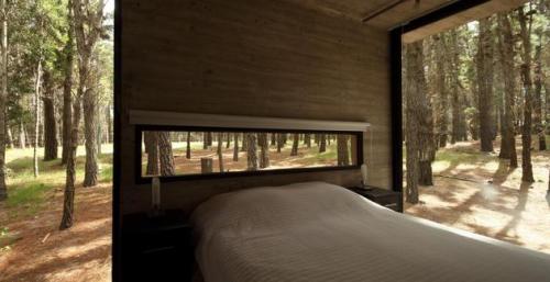northwestgearhead:  Unconventional concrete and glass summer house in Mar Azul, Argentina. Designed by BAK Arquietctos. The seamless glass walls truly make one feel as though they are outdoors, particularly in the bedroom flanked by windows. 
