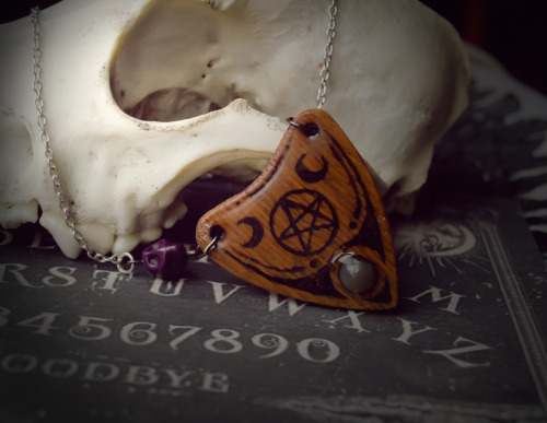 forgetallyouarein80s:  New ouija inspired pendants will be on sale very soon! I need your opinion: does it make sense to make more such planchette pendants with crystals, bones etc ?