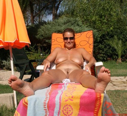 excaliburgold:  Sunbathing naked in the garden.