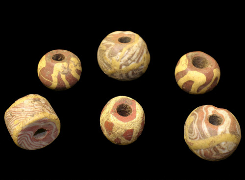 An array of beads from Saxon graves at Cliffs End, Kent, England. Ca. early 6th century to the 