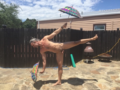 gorgeous-hunk86:Small and proudBalancing umbrellas on one foot with a sexy small penis and balls