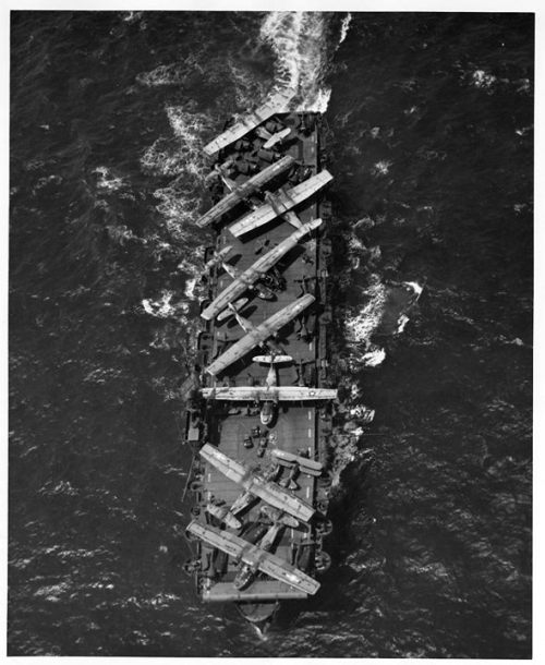 Escort Carrier USS Thetis Bay taking PBY Catalinas, F6F Hellcats, and one J2F Duck from Hawaii to Alameda for repairs, 8 July 1944. http://wrhstol.com/2tB7spy