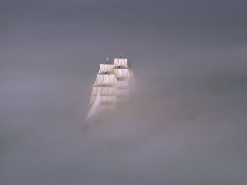 ltwilliammowett:A tall ship disappears into a thick fog in Rock Harbor, Massachusetts. Fog can make 