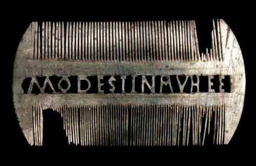 The ivory double-sided comb probably came from a woman’s tomb. The inscription has been explai