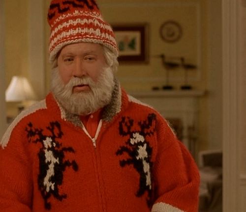 Santa Claus wearing what is arguably the most perfect sweater ever in his appearance in the great 90