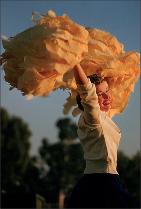 UCLA cheerleader, 1958this UCLA cheerleader cheers her football team on during an away game against 