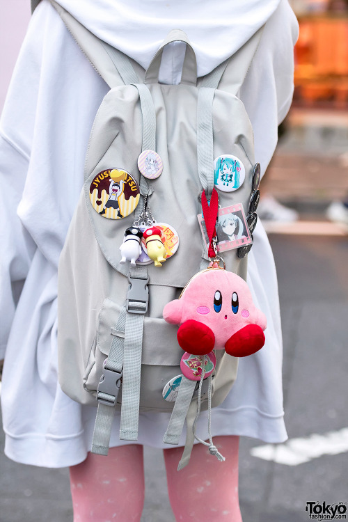 Gyoza-chan on the street in Harajuku wearing an oversized hoodie with Omochi Alien graphic tights, R