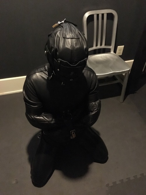 seabondagesadist:  Straitjacket and cell storage. The boy wanted to make me happy. Nothing makes me happier than a boy in heavy bondage, leathered and chained up in the cell for awhile… 😈😈😈 