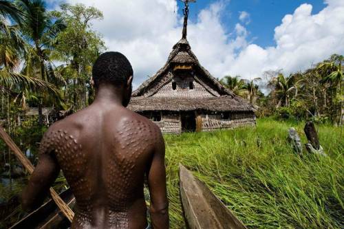 mvtionl3ss: Kaningara tribesmen, who inhabit the Blackwater river, a major tributary of the river Sepik in Papua New Guinea. Kaningara celebrate and revere crocodiles, which serve as a pretext to the initiation ceremony for young men – skin mutilation