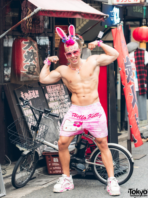 Austrian performance artist Candy Ken on the street in Harajuku wearing pink Hello Kitty fashion, bu