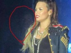 theparanormalblog:  Ghost Photographed at a Demi Lovato Concert?  It’s time once again for the world of ghouls and other-worldly beings to crossover with the world of gossip and scandals. That’s right, it’s time for more paranormal celebrity news!
