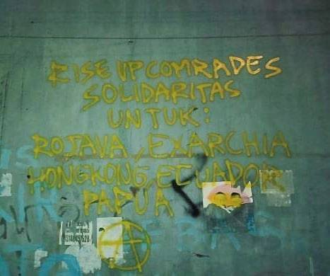 “Rise up comrades. Solidarity with: Rojava, Exarchia, Hong Kong, Ecuador, Papua” Seen in