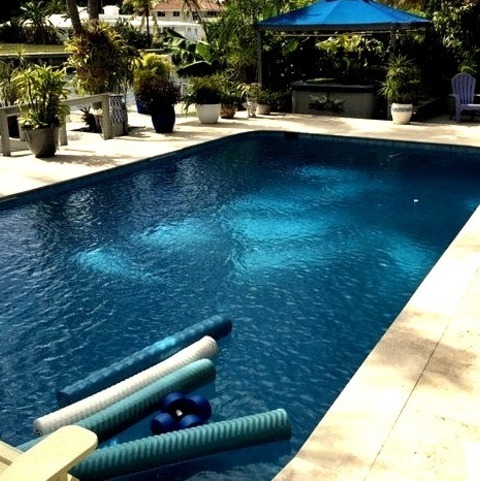 Miami PoolLarge Backyard With A Rectangular Above-ground Pool And Stones