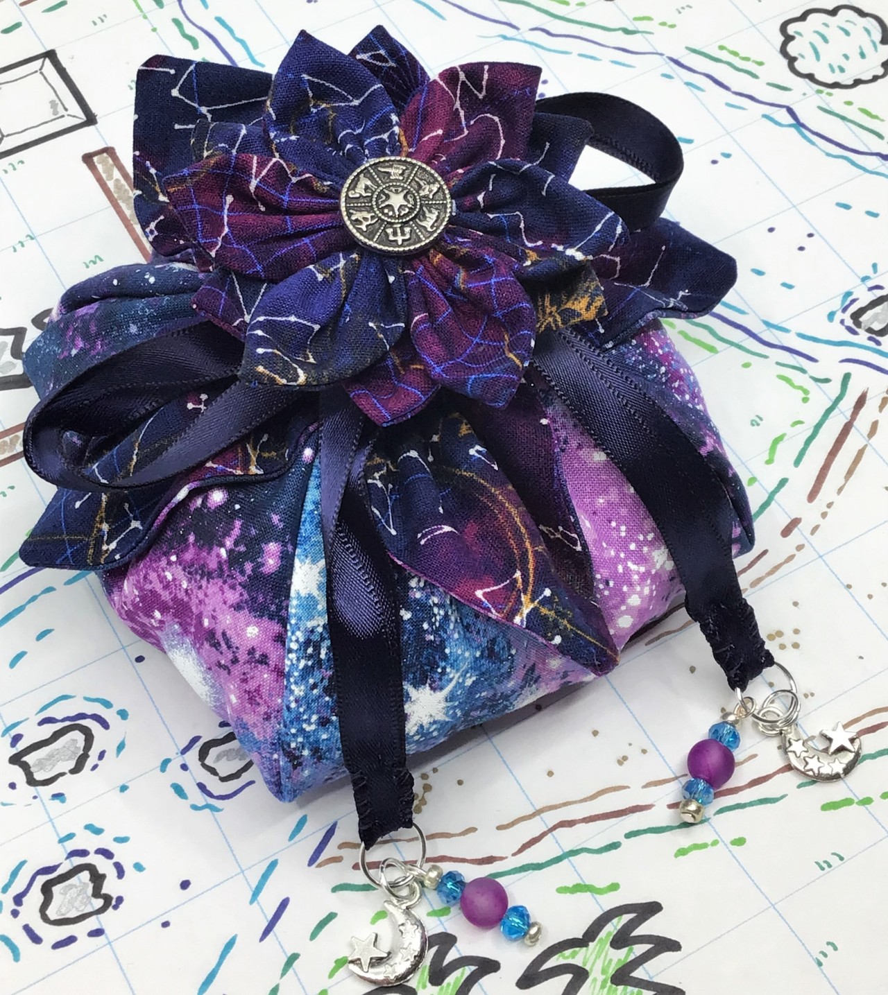 Stock Update!The “Onwards, to Forever and Beyond” dice bag has been added to the store!https://www.etsy.com/ca/shop/MagicandStitchcraft #dice#dice bag#dnd #dungeons and dragons #ttrpgs#dice storage#dice tray#space#stars#nebula
