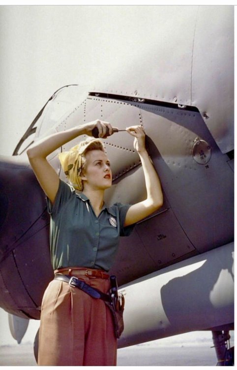 historicaltimes:A female Lockheed employee works on a P-38 Lightning, Burbank, CA, 1944 via reddit