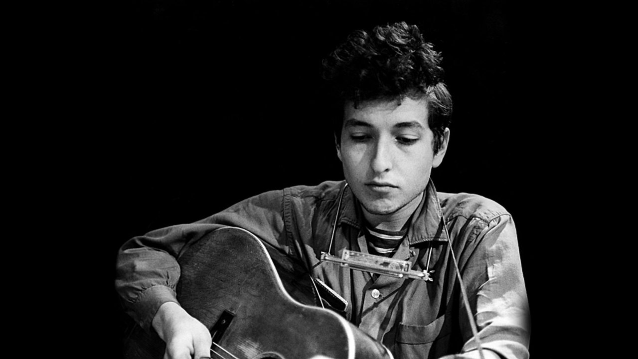 Black And White History Bob Dylan With His Harmonica And Guitar 1963