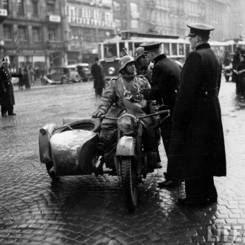 armyofczechoslovakrepublic:Year 1939, Czechoslovak republic, PragueGerman soldier is talking with Cz