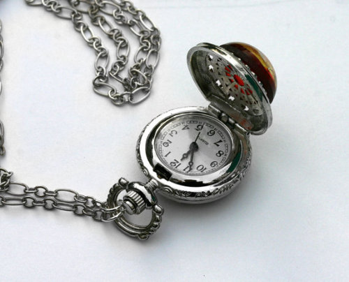 wickedclothes:Opal Pocket WatchTell the time on this fancy little opal pocket watch. Never be late a
