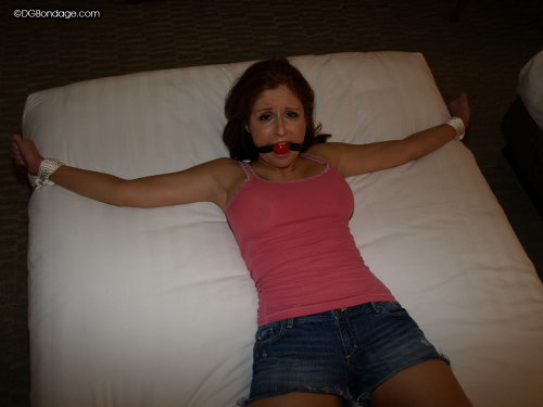 zippo077:  Attacked in her hotel room by an intruder posing as a maintenance man, Stacey is tied spreadeagled to the bed and gagged. Having been robbed of all her cash and cards, and unable to escape the tight ropes, all Stacey can do is wait until mornin
