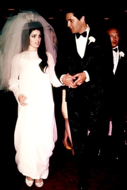 takingcare-of-business:  Elvis and Priscilla Presley getting married at Aladdin Hotel suite in Las Vegas, May 1, 1967.