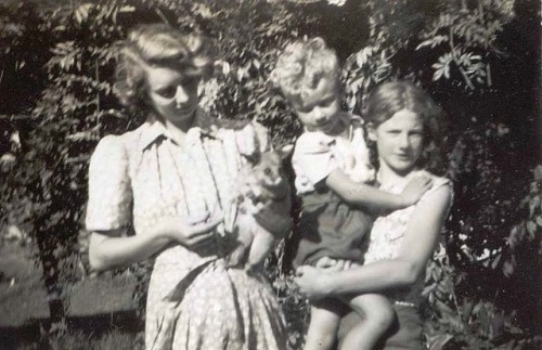 Some relatives, with a brushtail possum (1950s)