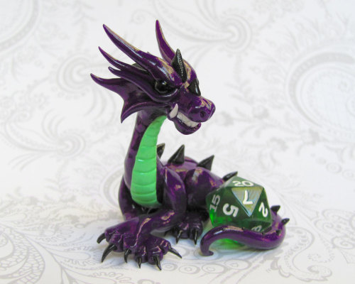 tomarou:  rosesakurax:  thatfilthyanimal:  ensorevolution:  Tiny Dragons That Take Care of Your Gaming Dice http://www.themarysue.com/dice-dragons-becca-golins/#0  [SCREAMS] I WANT THEM  Cuteee  I couldn’t resist reblogging; NO REGRETS 