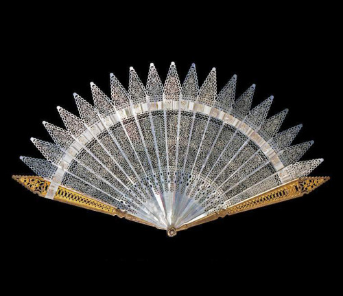 Fan, Pierced mother-of-pearl, made in Italy or Spain, no date. With pierced, gilt, metal guards and 