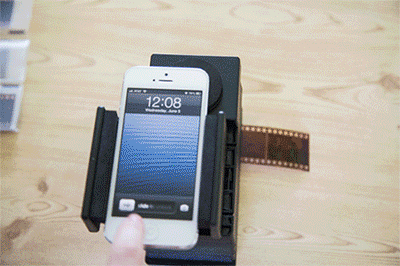 photojojo:  Analogue + Digital = One amazing gizmo! The Smartphone Film Scanner brings your 35mm into the digital world. Simply mount your smartphone, slide in your film, use a free app to invert the colors and snap a pic! It works with iPhones, Androids