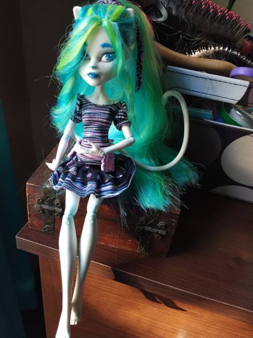 My first attempt at doing a faceup/reroot of a monster high doll! A little rough but I think she loo