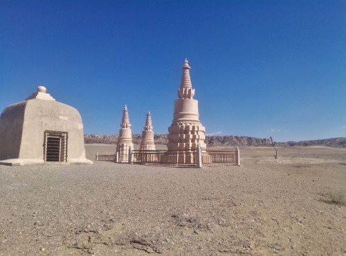 picturesofchina: A small shrine with stupas in the desert near Dunhuang, Gansu