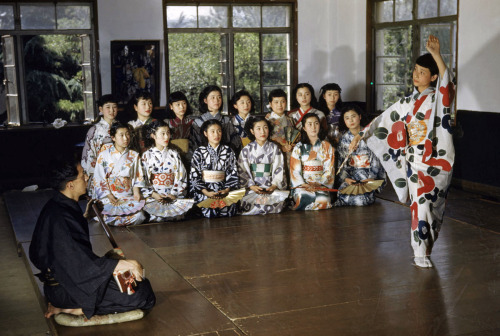 A girl dances to shamisen music as classmates watch, Takarazuka, Japan, 1950sPh. J. Baylor Roberts