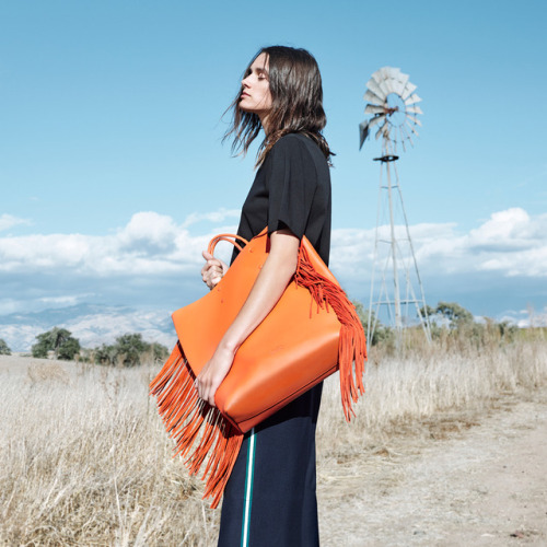 Fringe benefits: a high-impact CK CALVIN KLEIN tote in luxe, supple leather, finished with a cascadi